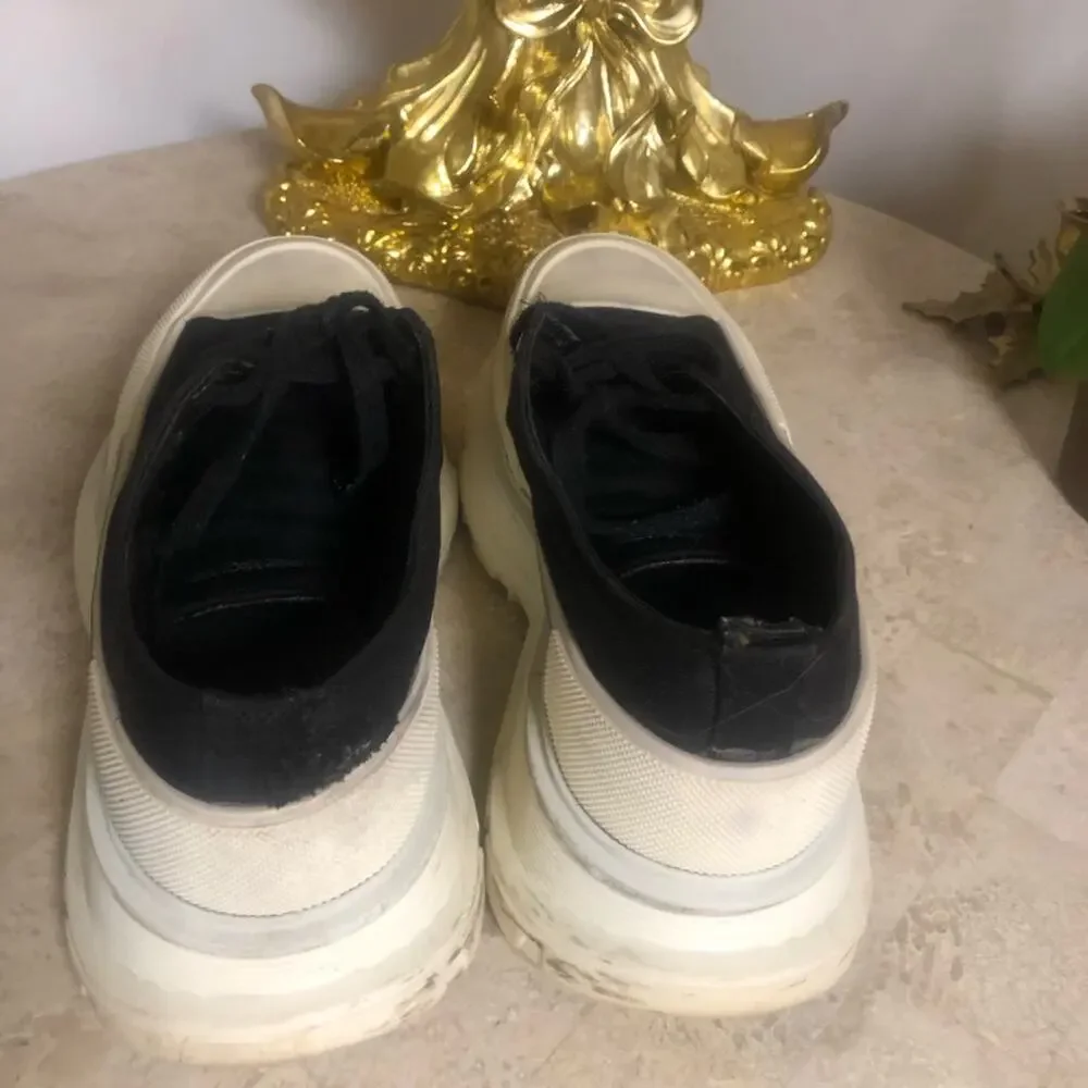 Alexander McQueen black and white platform chucks.